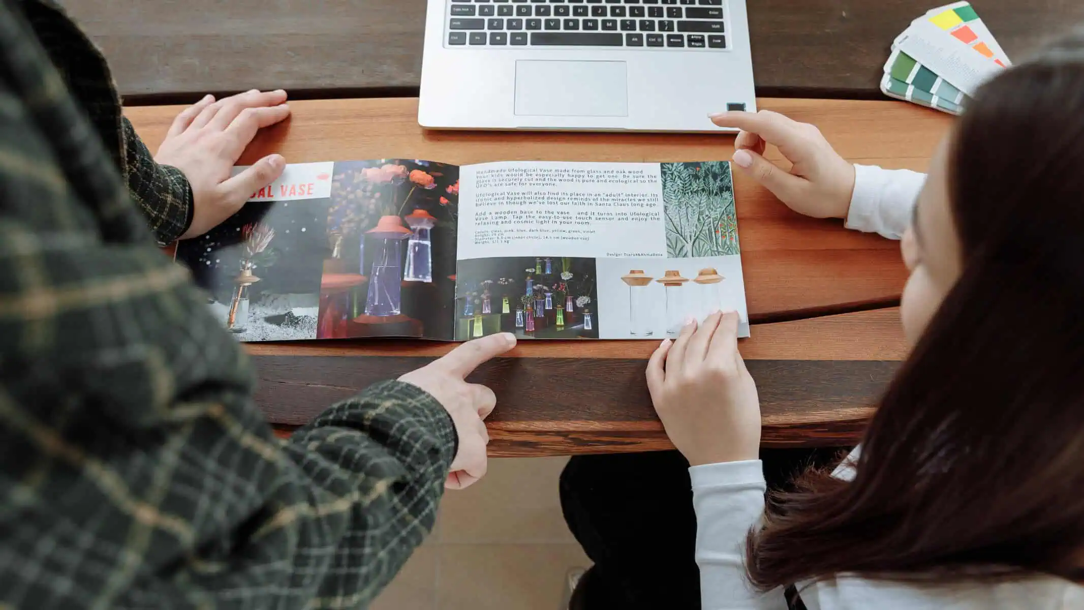 Two People Designing Professional Brochures