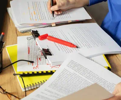 book editor reviewing manuscript before publishing book