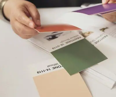 a client sorting through colors for print production of new folding cartons