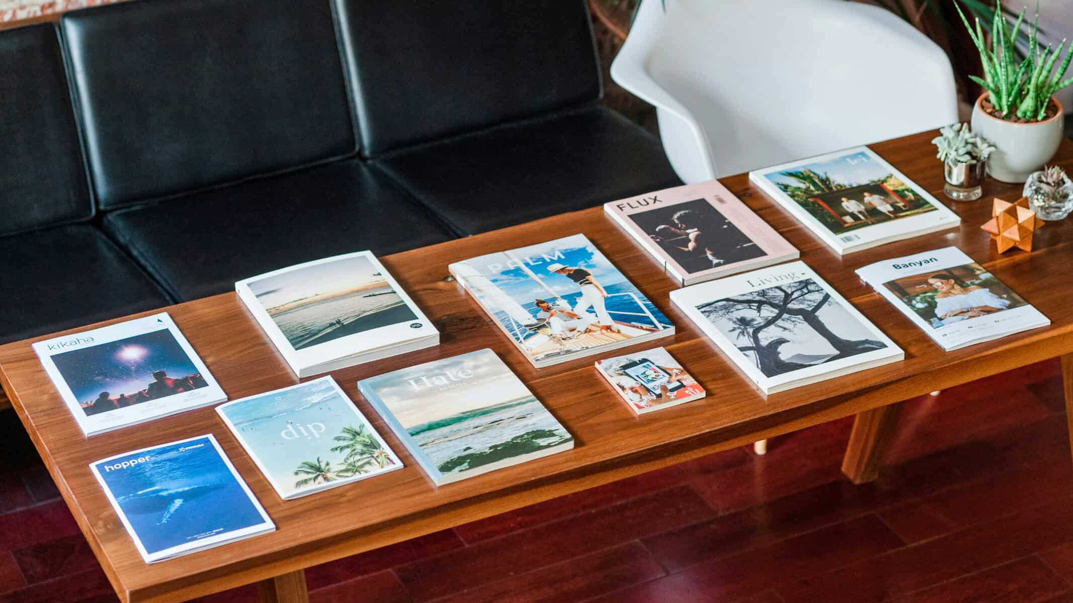 Printed books and magazines on coffee table for brand marketing
