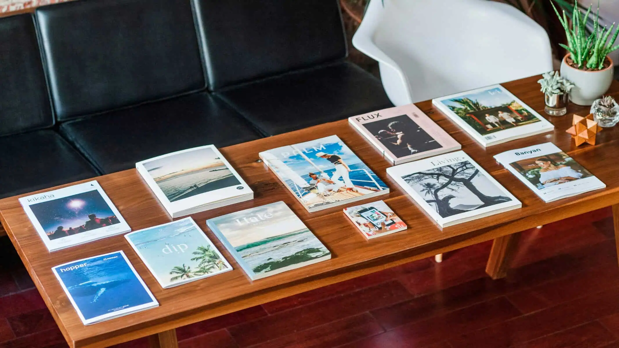 Printed books and magazines on coffee table for brand marketing