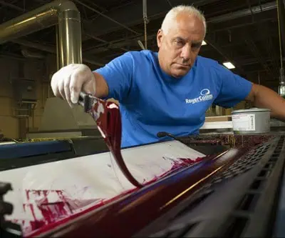 RoyerComm employee working on an offset printing project